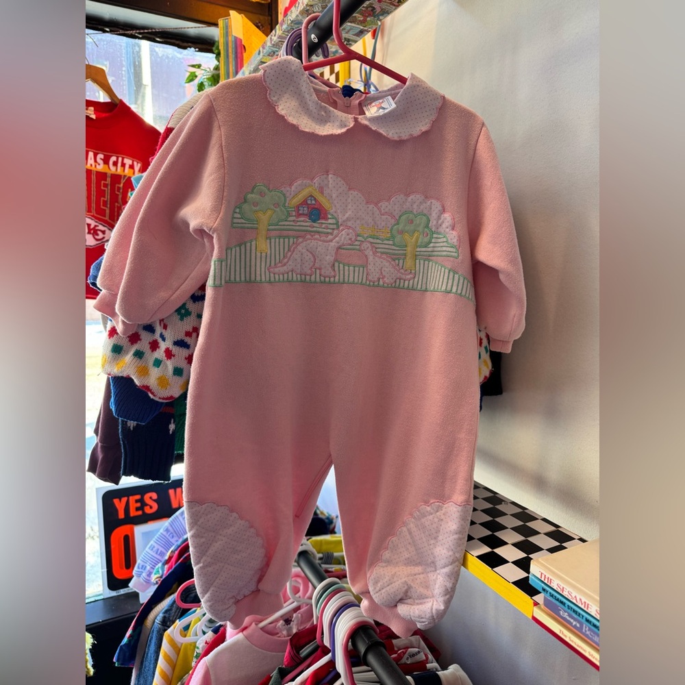 Adorable pink dinosaur fleece romper